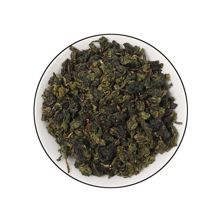 White Buds Chelan Spring Tea in a bowl, unroasted oolong leaves, Pinghe origin.